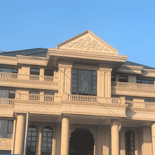 新余黄金麻别墅外墙干挂石材效果示例